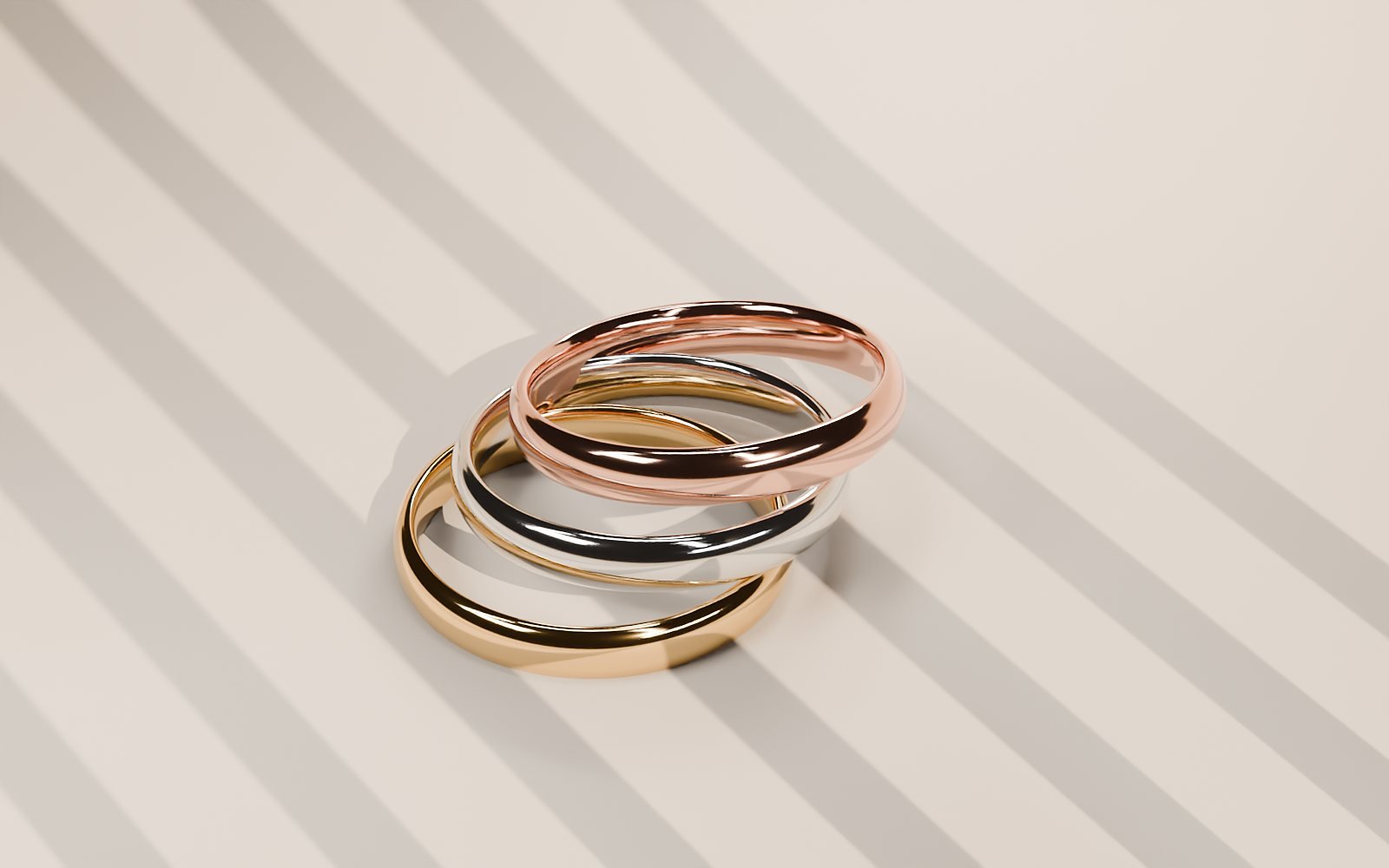 Tres argollas en oro amarillo, blanco y rosa
