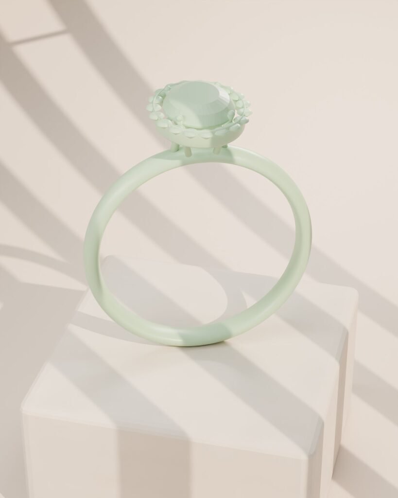 Modelo de anillo en cera junto a la pieza terminada