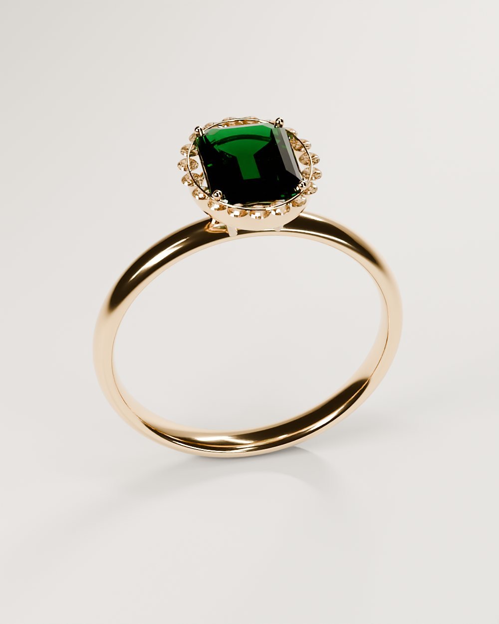 Anillo de esmeralda con halo de diamantes